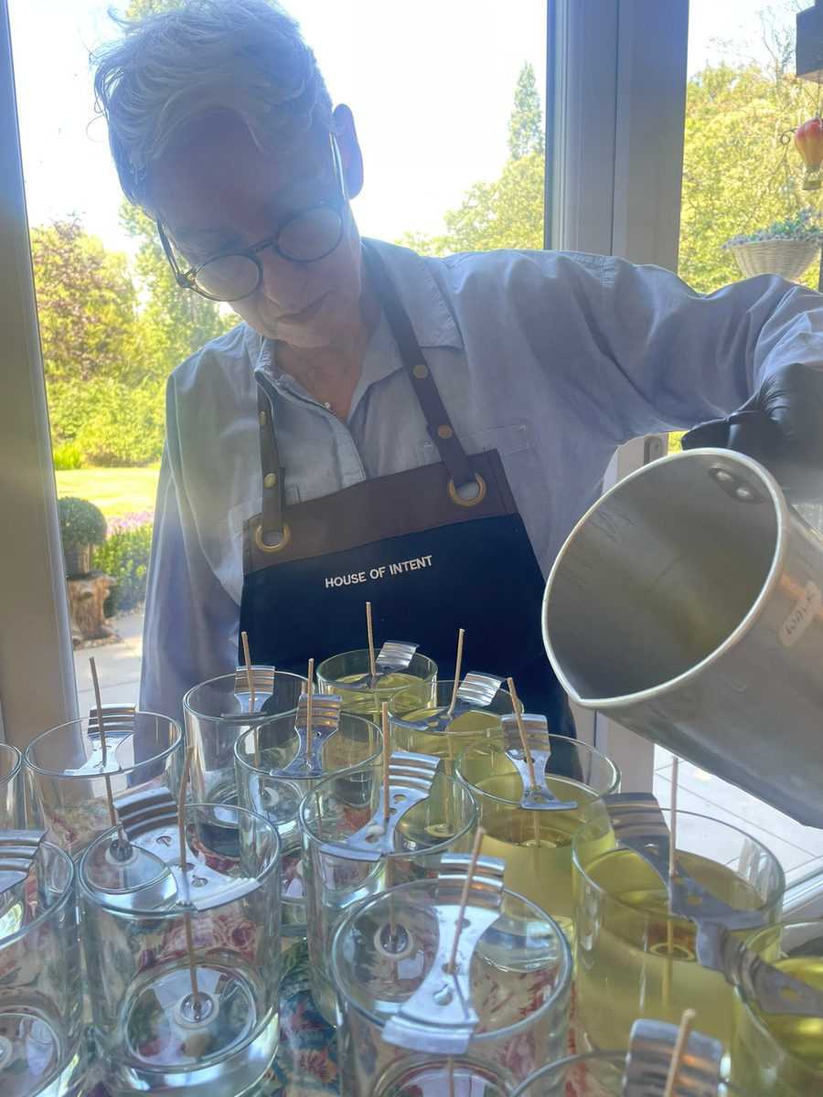 Michele hand-pouring candles in the House of Intent studio